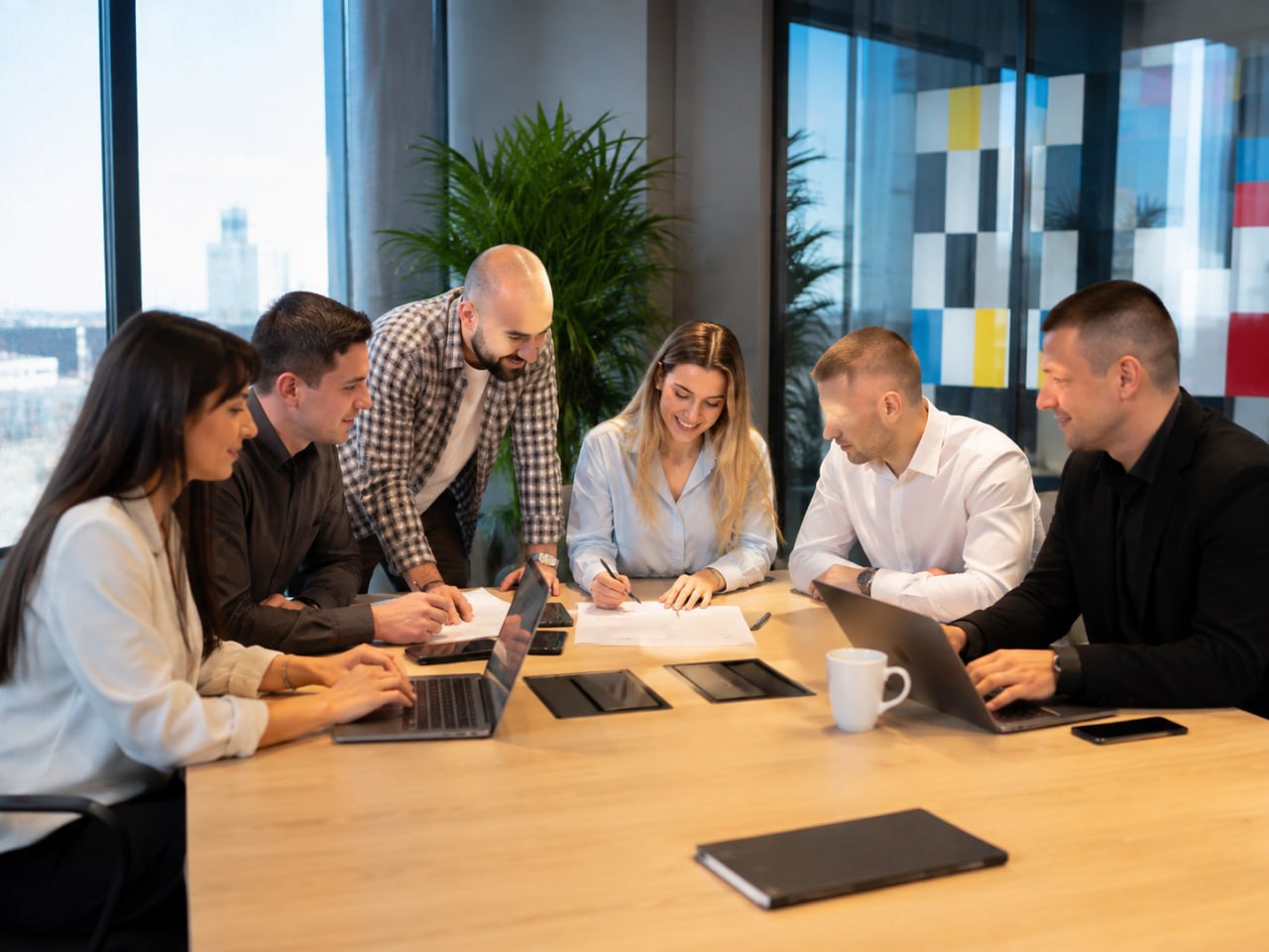 Technology team collaborating around a conference table